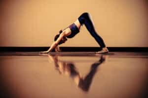 Yoga pose with reflextion on floorr