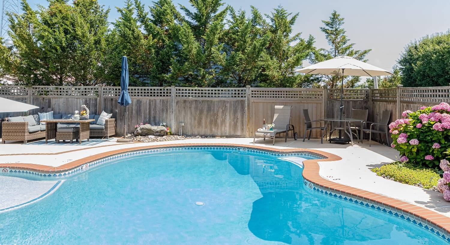 Exterior view of property's pool, patio, and patio furniture